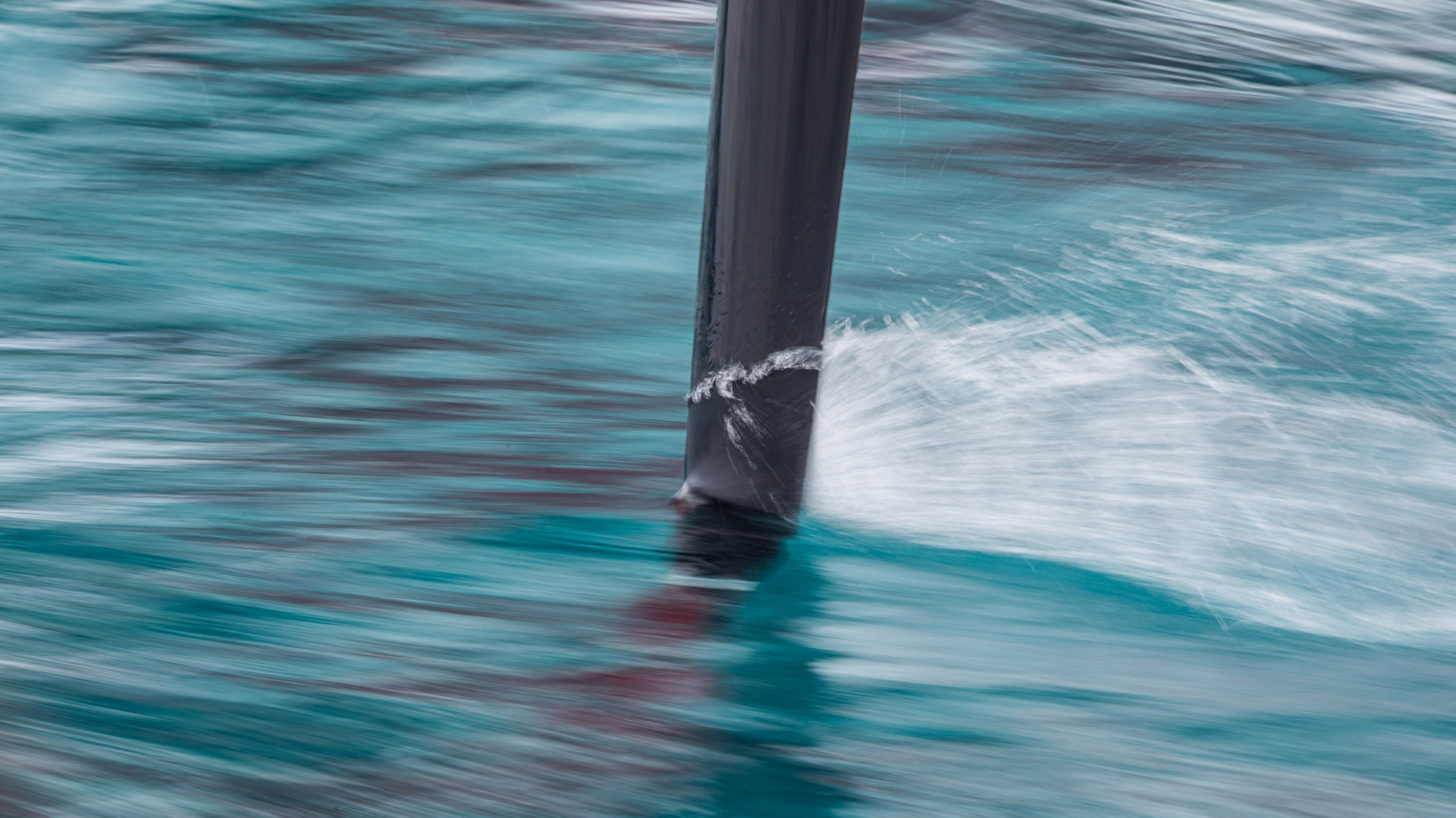 A close-up of the F50s hydrofoils cutting through the water.